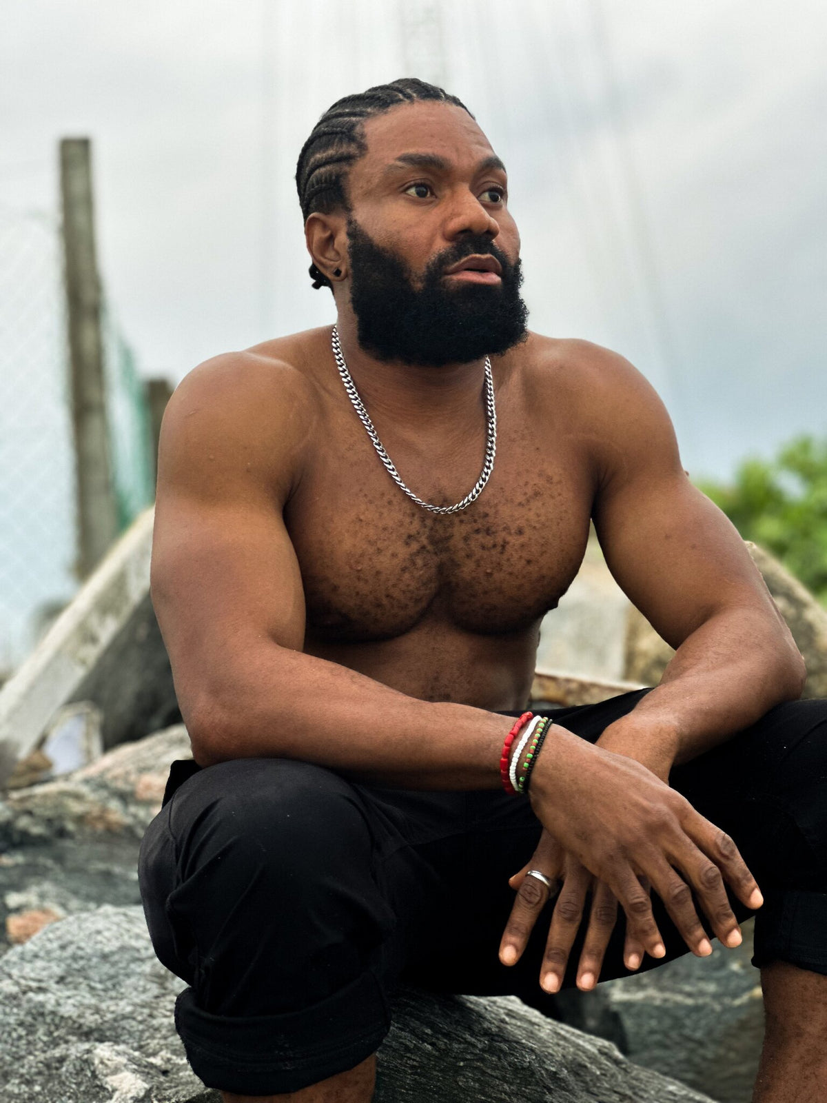 Model wearing the Odùduwà Ancestral Bracelet, hand-strung coral beads