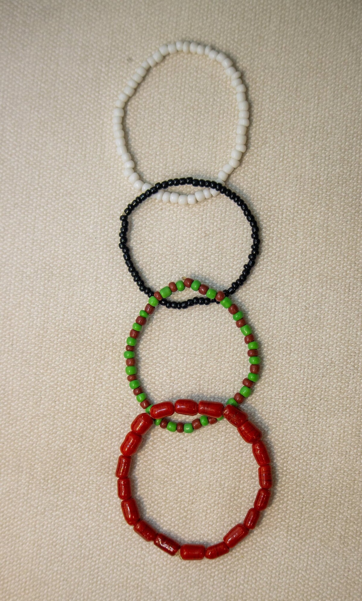 Odùduwà Ancestral Bracelet detail, genuine coral and Ilé-Ifẹ̀ glass beads