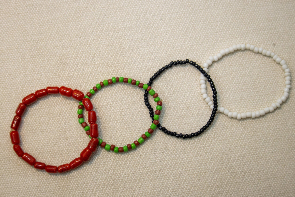 Odùduwà Ancestral Bracelet detail, genuine coral and Ilé-Ifẹ̀ glass beads