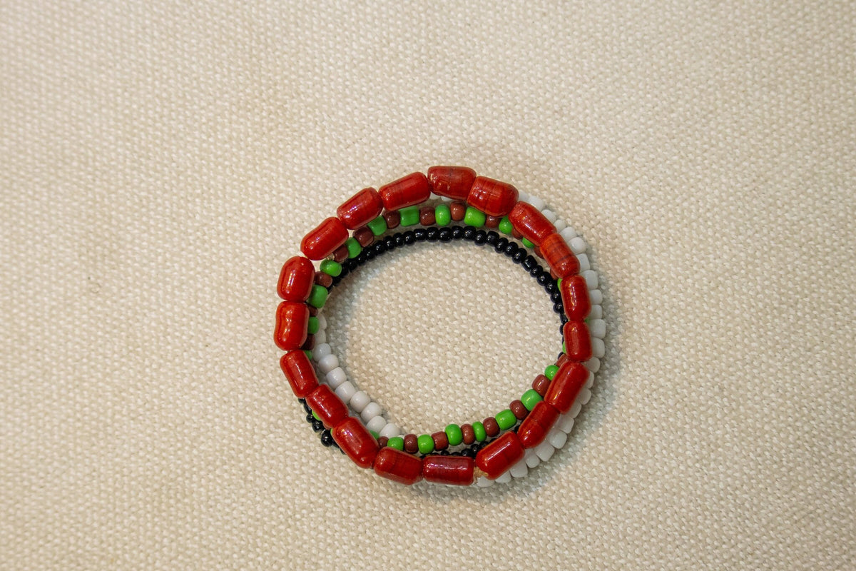 Odùduwà Ancestral Bracelet worn on wrist, three-strand genuine coral bead set