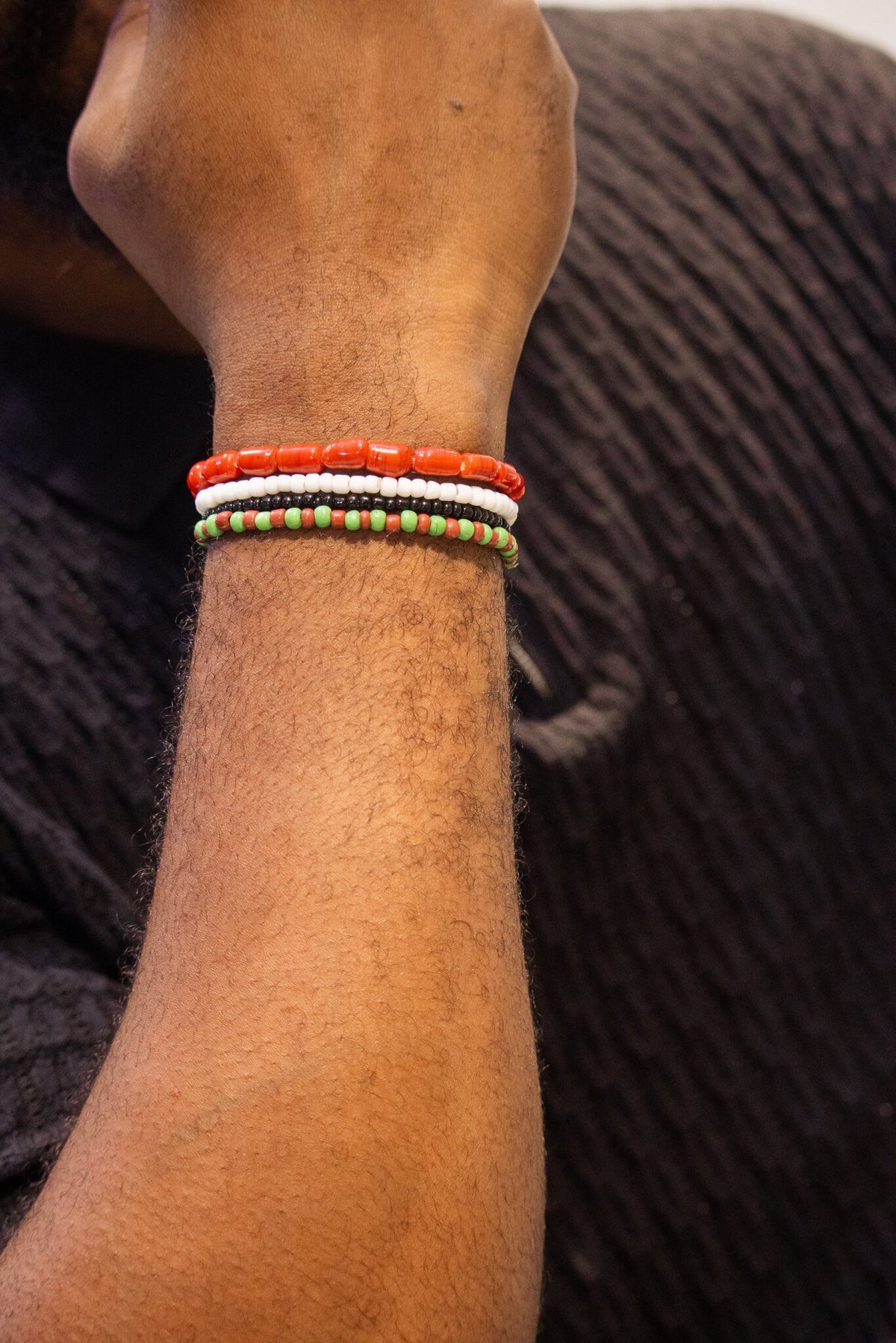Odùduwà Ancestral Bracelet worn on wrist, three-strand genuine coral bead set