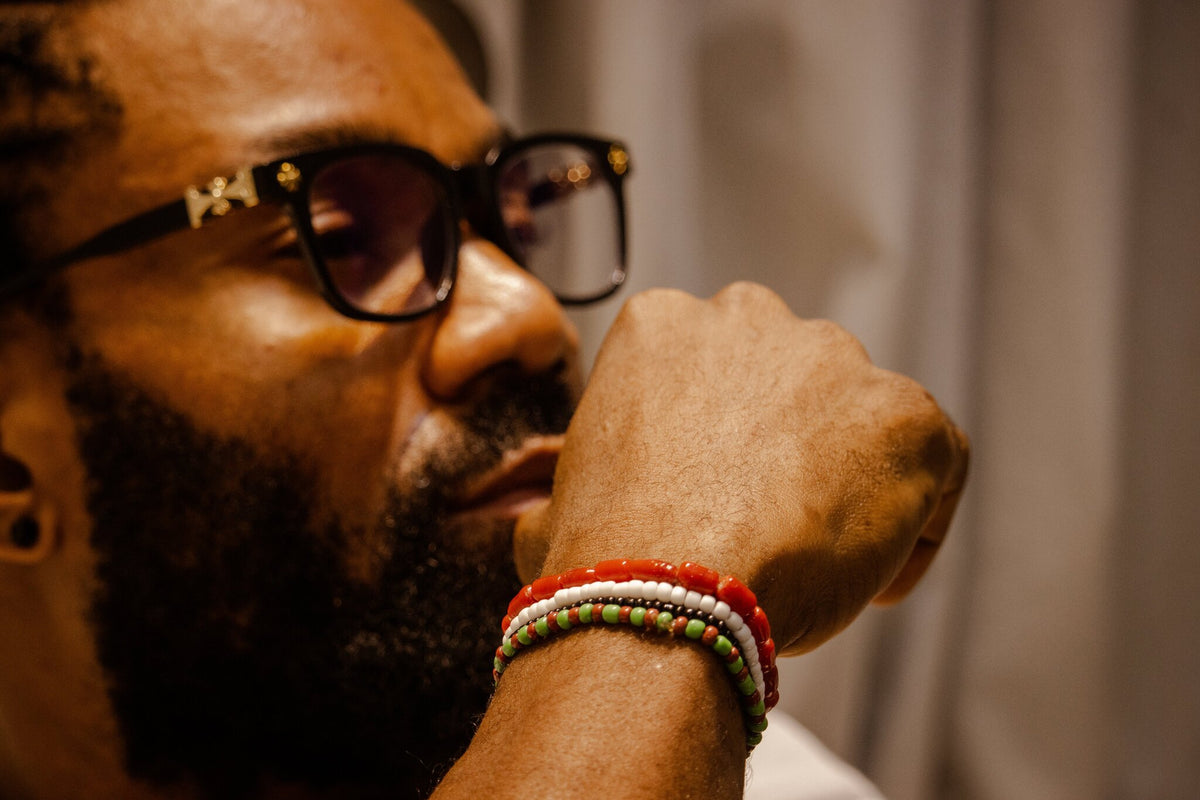 Odùduwà Ancestral Bracelet worn on wrist, three-strand genuine coral bead set