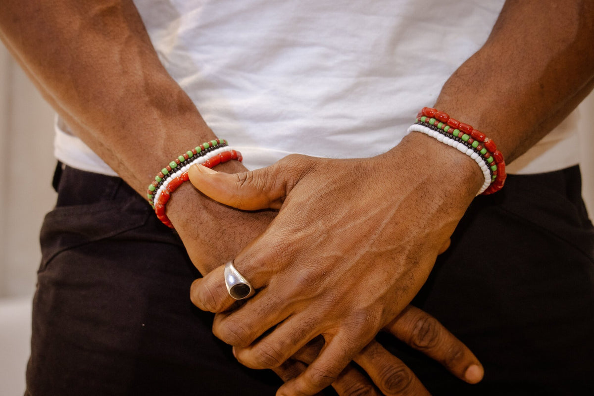 Odùduwà Ancestral Bracelet worn on wrist, three-strand genuine coral bead set