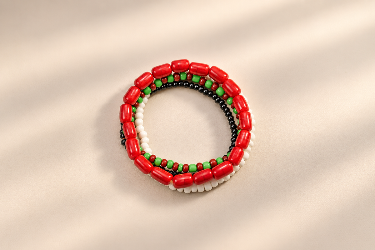 Odùduwà Ancestral Bracelet worn on wrist, three-strand genuine coral bead set